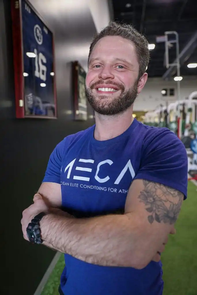 Logan headshot taken at MECA gym.