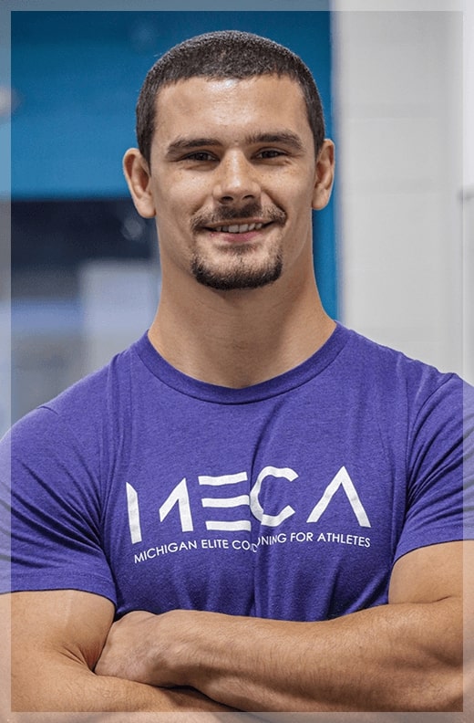 a man with a beard and mustache wearing a purple shirt