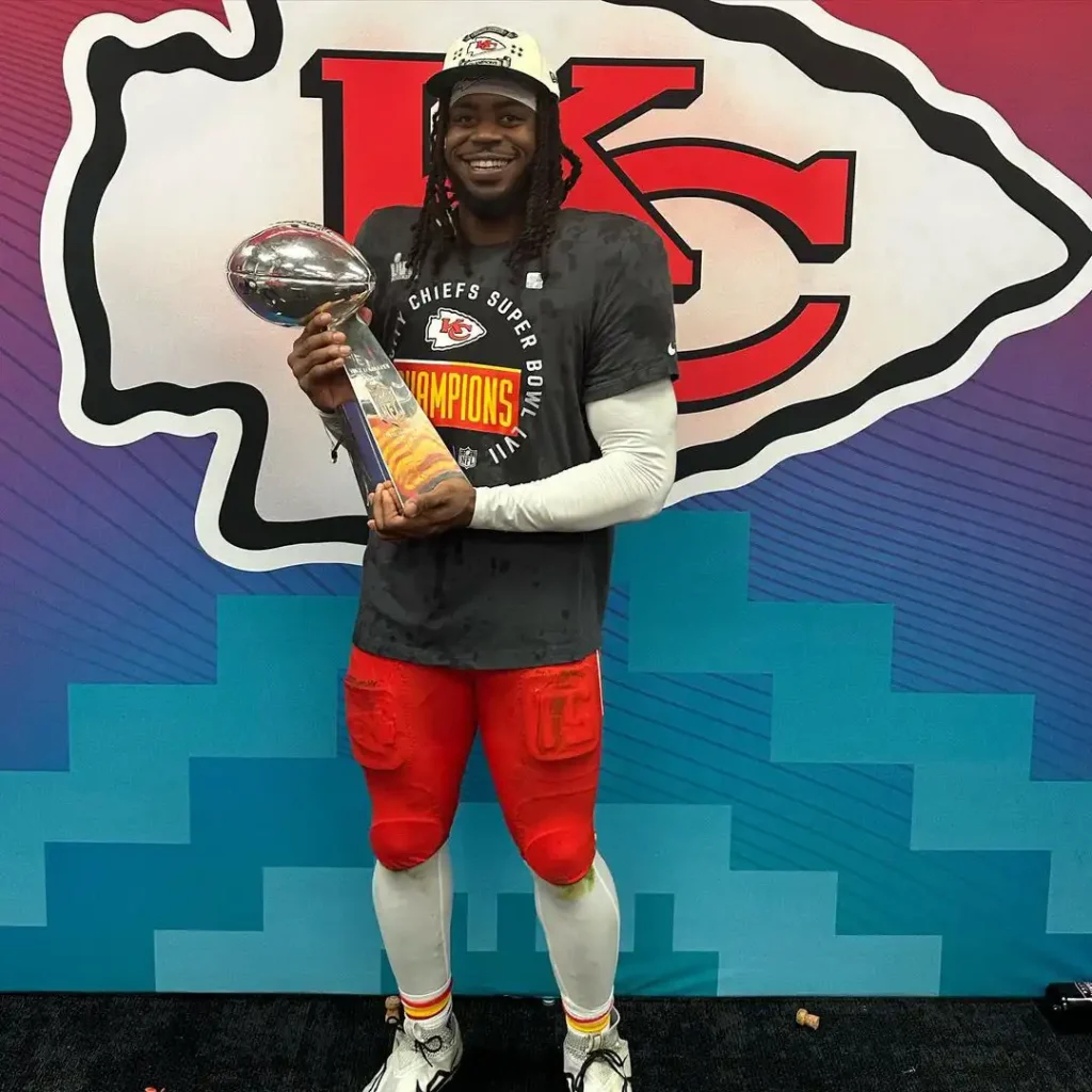 mike holding the vince lombardi trophy