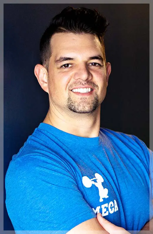 a man with a beard and mustache smiling