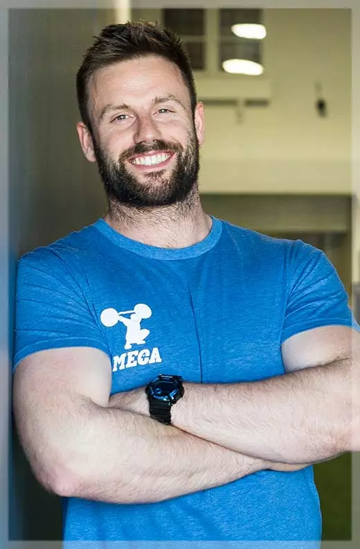 David Lawrence with a beard and a blue shirt who is also a personal trainer at MECA