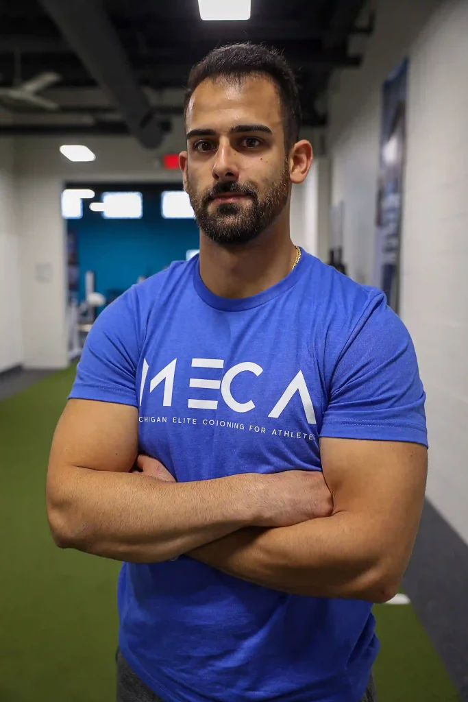 Joey Lajcaj, an assistant strength coach at MECA Royal Oak, poses for a headshot.