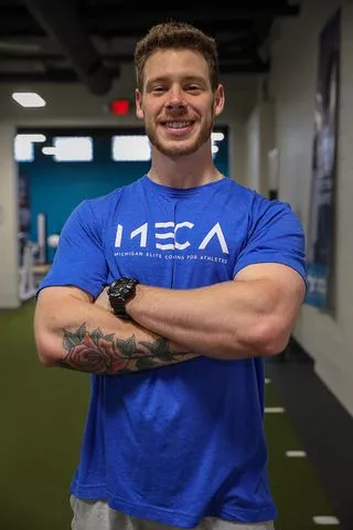 A headshot of a training coach at MECA Royal Oak.