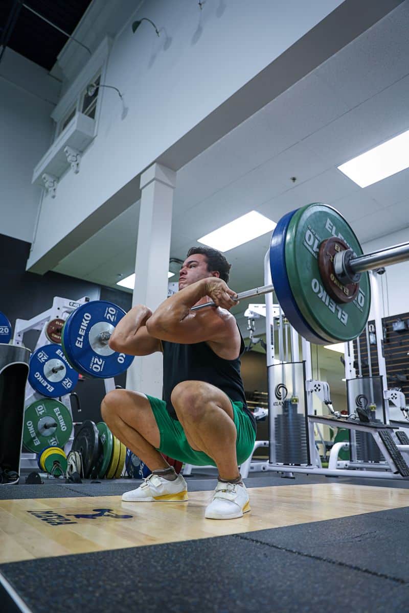 Man Deadlifting a barbell for strength training at MECA